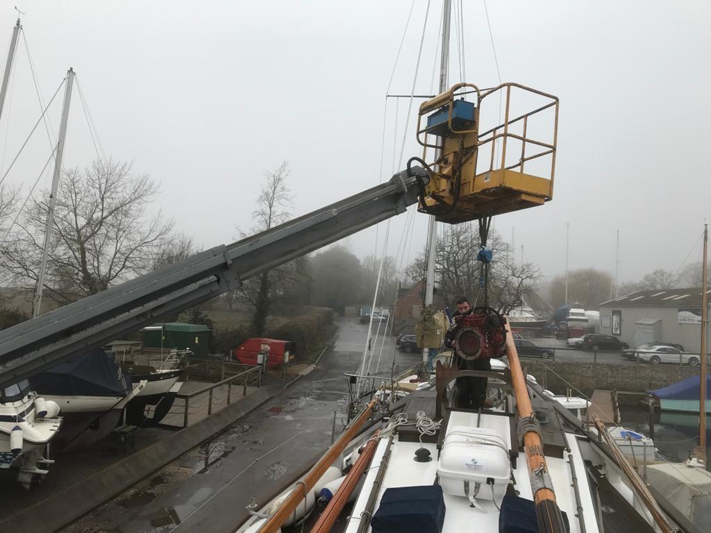 Boleh’s volunteer Skippers will not be sorry to wave goodbye to the Beta, seen here being lifted out of the main hatch. Refit plans schedule mid-March for installation of the new generator.